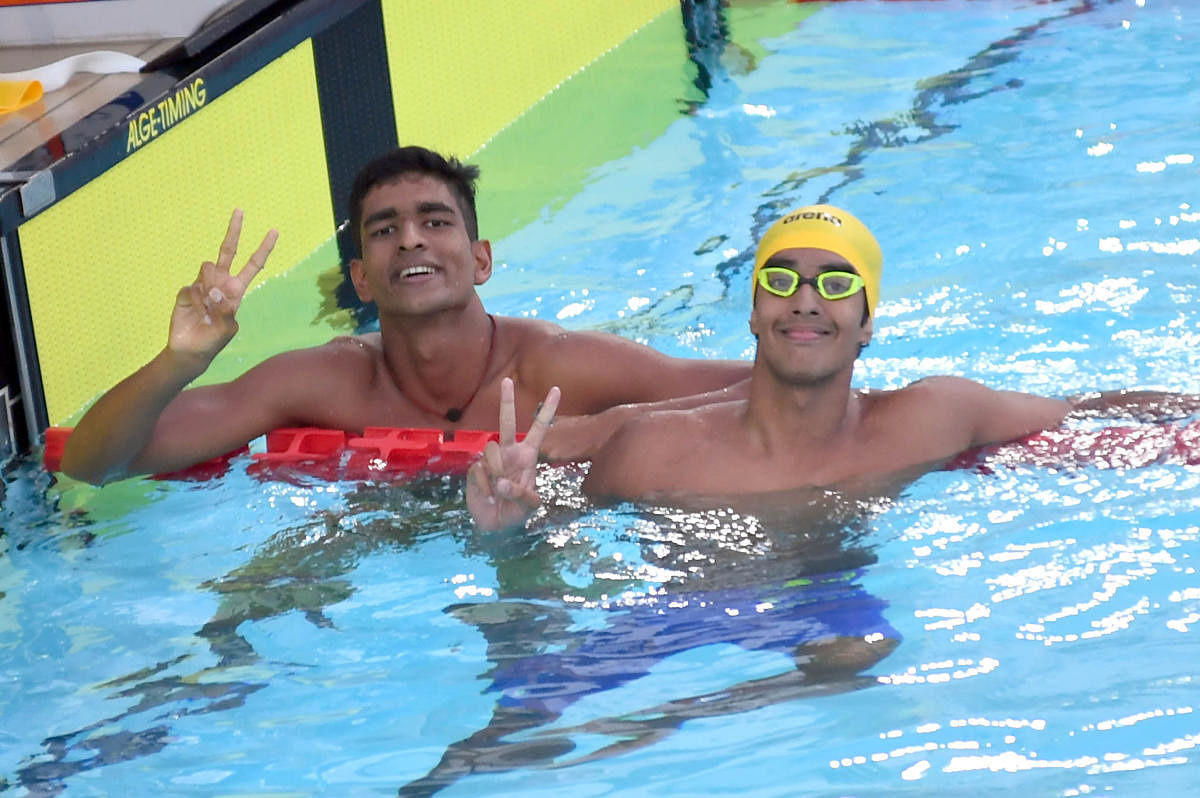 India's Srihari Nataraj (right) and S Siva celebrate after claiming gold and silver respectively in the men 200m backstroke event on Friday. DH PHOTO/ SRIKANTA SHARMA R