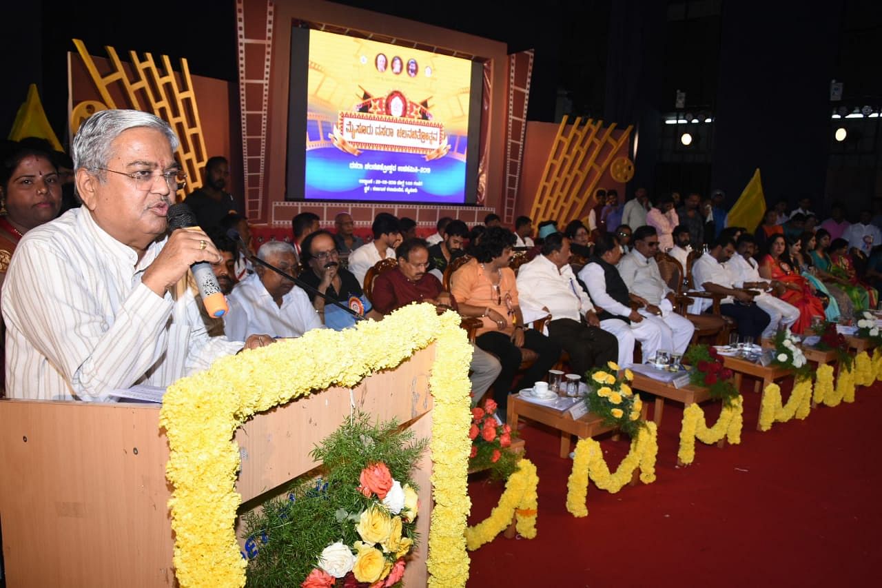 DCM Govinda M Karjol addressees the gathering of inaugural ceremony of Dasara Film Festival, at Kalamandir, in Mysuru, on Sunday. (DH Photo)