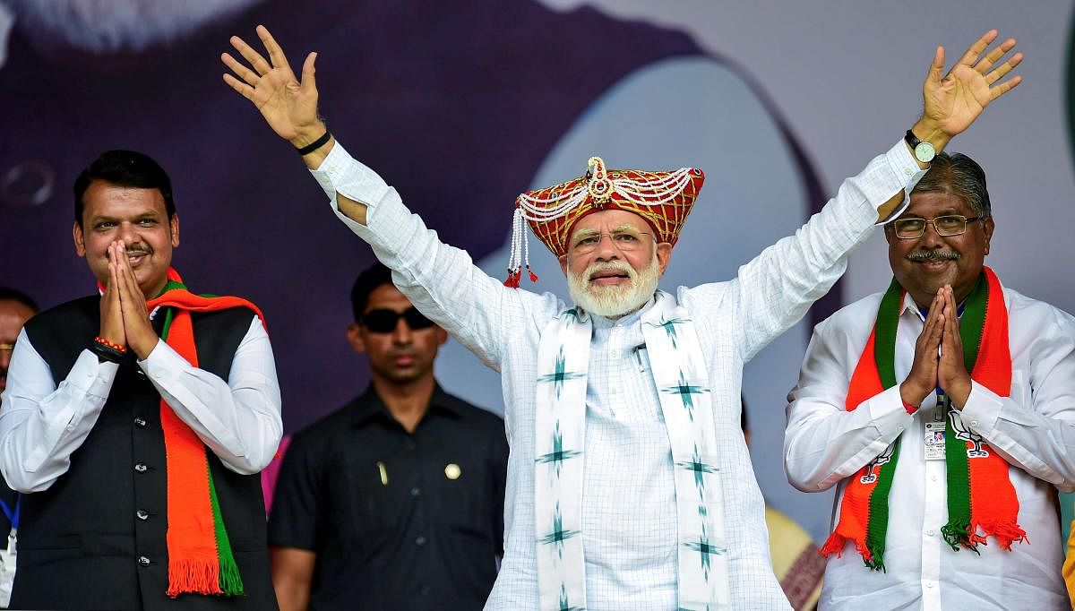  Prime Minister Narendra Modi, Maharashtra Chief Minister Devendra Fadnavis and newly appointed BJP member Udayanraje Bhosle during the 'Vijay Sankalp Rally' in Nashik on Sept. 19, 2019. Launching the BJP's campaign for next month's Assembly elections in Maharashtra, PM Modi lauded CM Devendra Fadnavis for providing a "stable government" in the last five years, despite BJP not having a complete majority on its own. Photo/PTI
