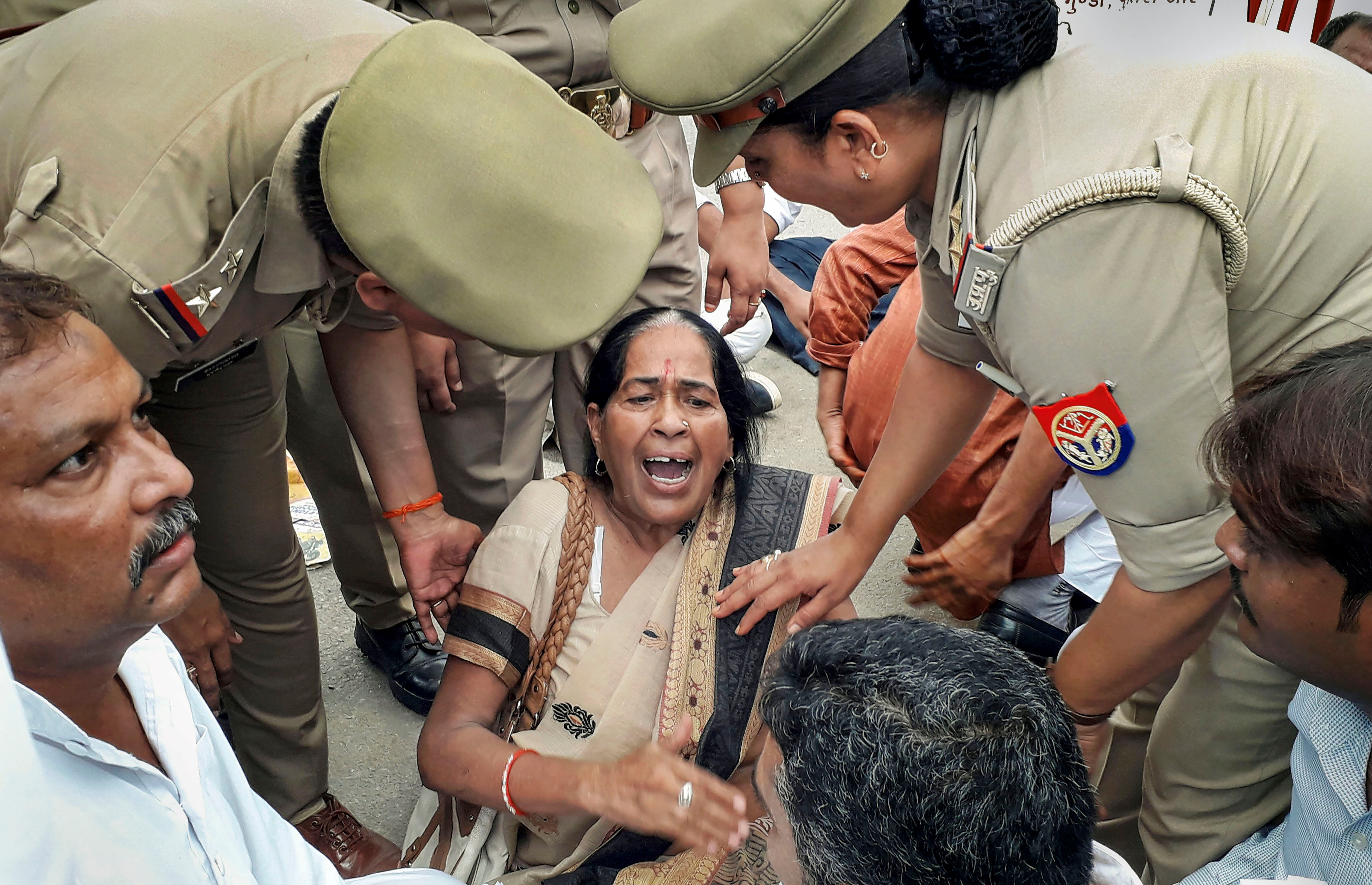 Police personnel detain supporters of Congress leader Jitin Prasada after being refused permission to take out a march in support of the jailed law student who has accused the BJP's Chinmayanand of rape (PTI Photo)