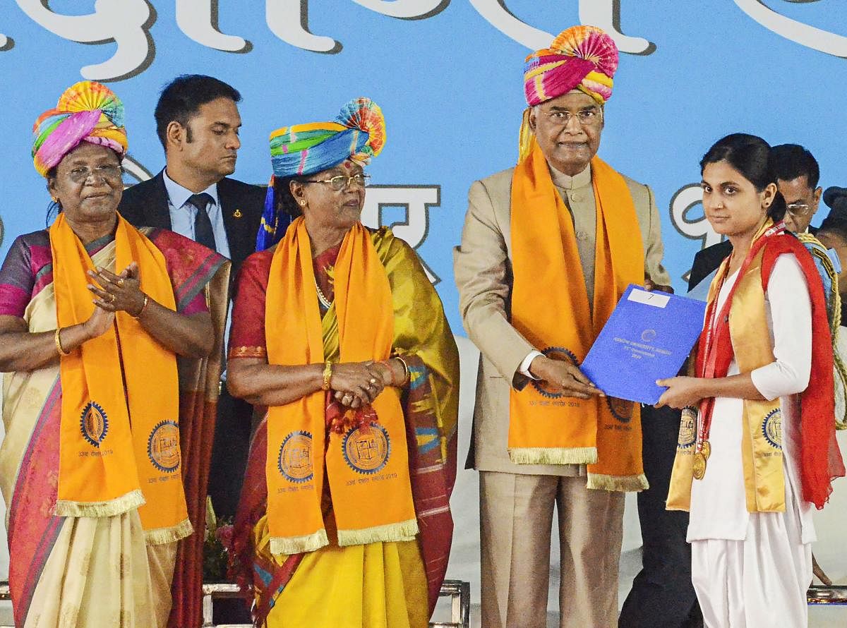 President Ram Nath Kovind presents a degree certificate to a student during the 33rd convocation ceremony of Ranchi University at Dikshant Mandap auditorium. First Lady Savita Kovind and Jharkhand Governor Droupadi Murmu are also seen. PTI