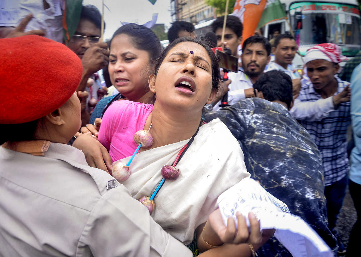 Police personnel detain Youth Congress activists during a protest against price hike of onion and other essential commodities, in Guwahati, Monday, Sept 30, 2019. (PTI Photo)