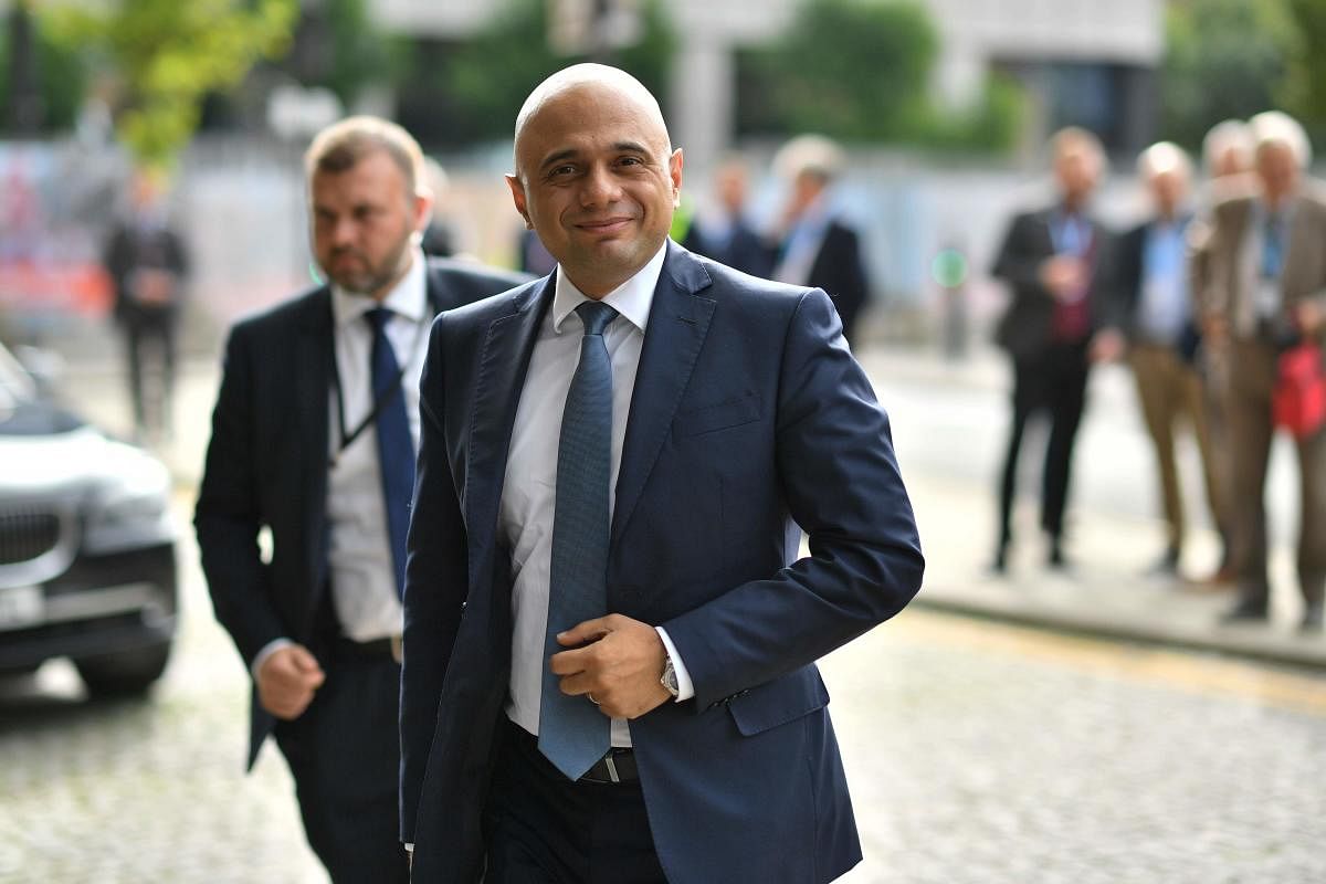 Britain's Chancellor of the Exchequer Sajid Javid arrives at The Midland hotel opposite the Manchester Central convention complex on the second day of the annual Conservative Party conference at the in Manchester, north-west England on September 30, 2019. (AFP)