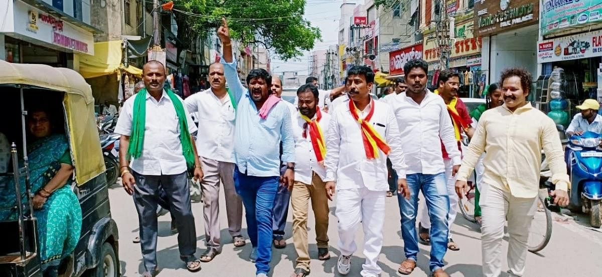 A rally being held in Ballari on Monday to create awareness among the people about Tuesday's bandh opposing the bifurcation of the district. dh photo