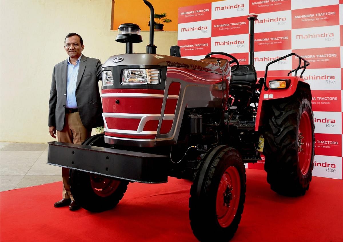 Pawan Goenka, MD, Mahindra and Mahindra displaying a driverless tractor developed by the company, at the Mahindra Research Valley. (PTI Photo)