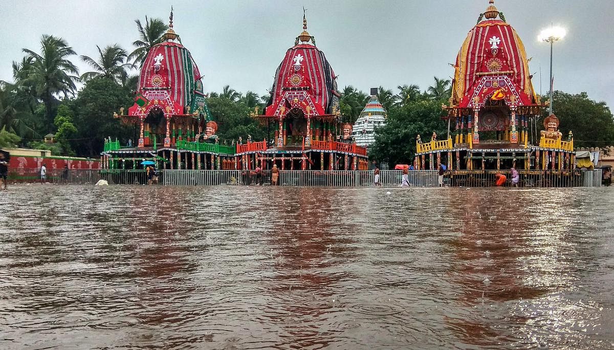 A view of three chariots inundated in rain water at Nakachana Dwaar at Gundicha temple in Puri, on Saturday, July 21, 2018. Photo/PTI
