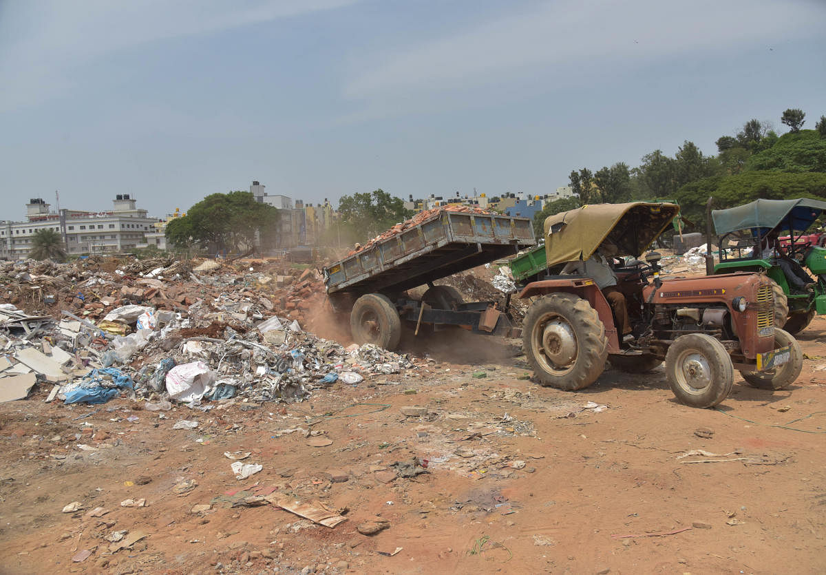 Private vacant land near Veerabhadra Nagara, close to the entrance of NICE road has become most sought after place for dumping. (DH Photo)
