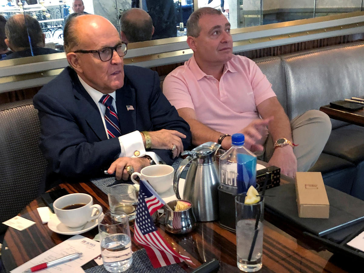 Donald Trump's personal lawyer Rudy Giuliani has coffee with Ukrainian-American businessman Lev Parnas at the Trump International Hotel in Washington, U.S. September 20, 2019. Reuters file photo