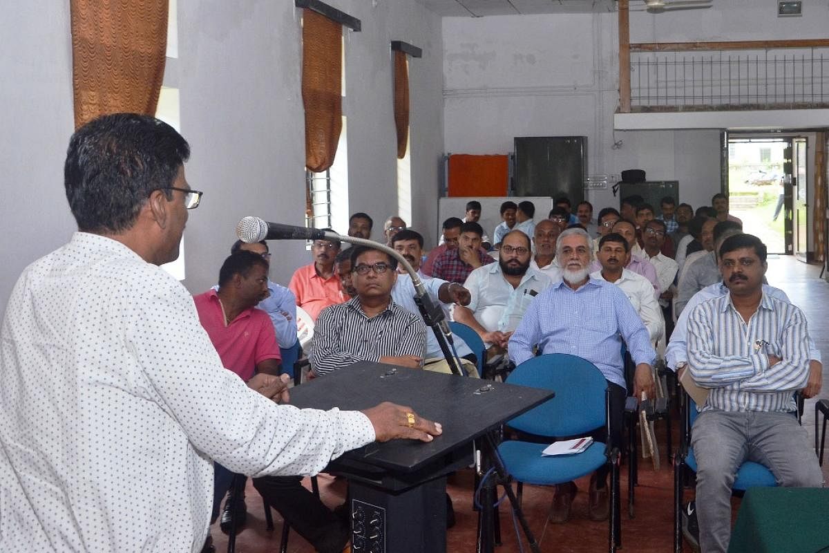 Central Coffee Research Institute (CCRI) in-charge director Dr Sooryaprakash Rao speaks at an International Coffee Day programme at Balehonnur.