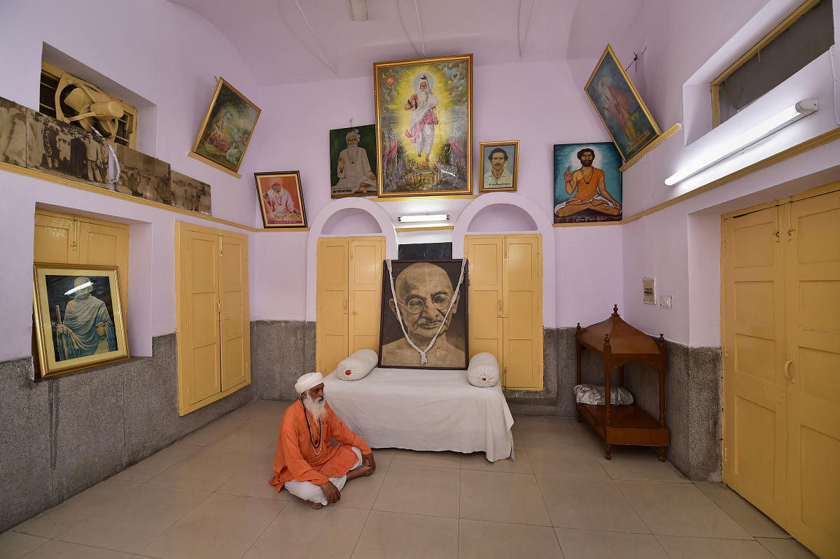 Portraits of Mahatma Gandhi seen inside a Valmiki Temple, on Mandir Marg, in New Delhi, Thursday, Sept 26, 2019. (PTI Photo)