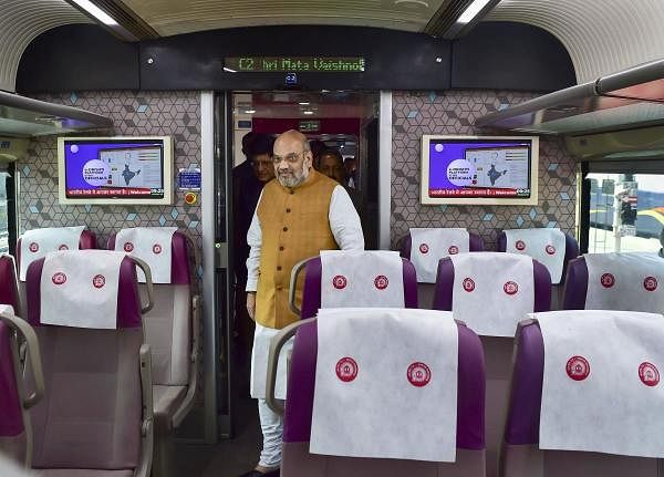 Union Home Minister Amit Shah inside a coach of the semi -high-speed train Vande Bharat Express before its flags off ceremony at New Delhi Railway Station, in New Delhi. (Photo/PTI)