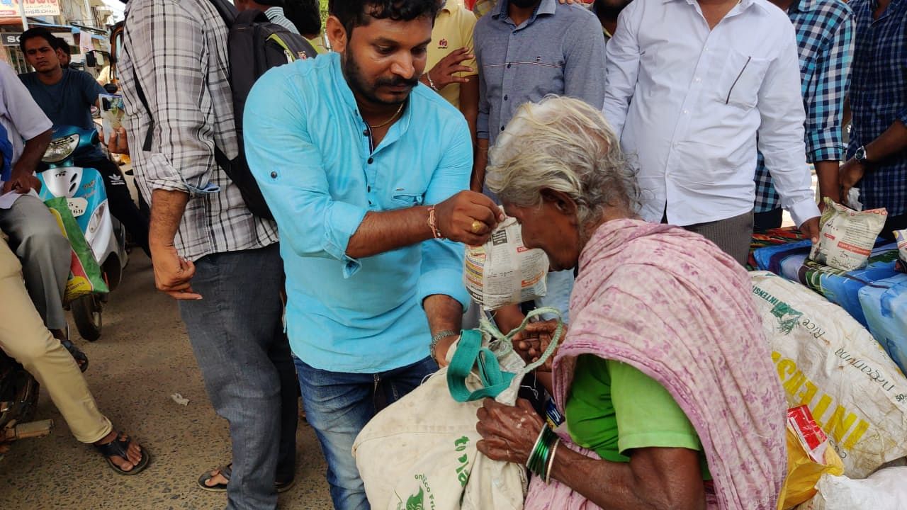 Members of the Facebook group exchanging plastic with rice in Peddapuram