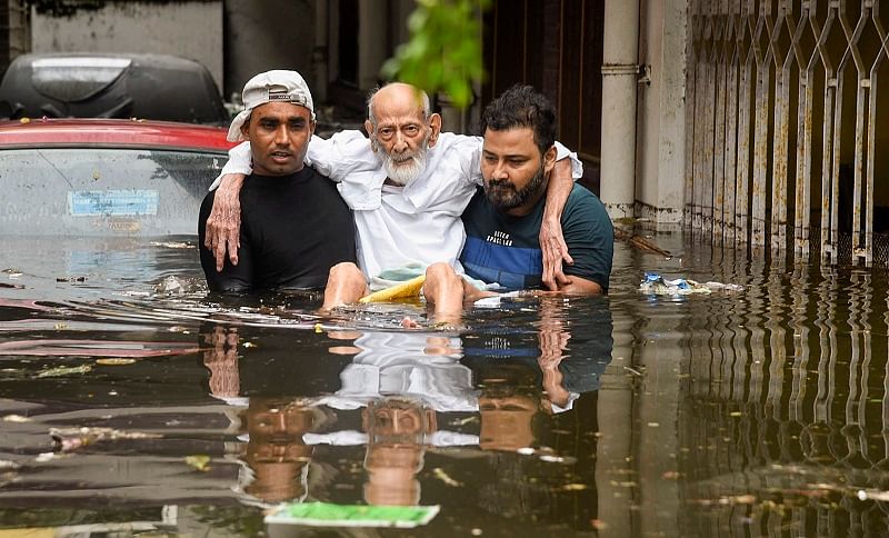 An elderly person being rescued from a flood-affected colony at Rajendra Nagar in Patna. (PTI Photo)