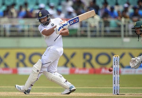 India's Rohit Sharma plays a shot on the 2nd day of the 1st test cricket match played against South Africa at Dr YS Rajasekhara Reddy ACA-VDCA Cricket Stadium, in Visakhapatnam. (PTI photo)