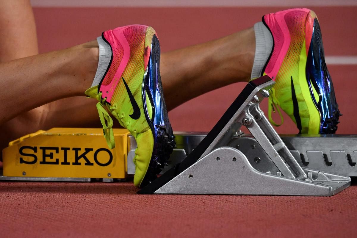 An athlete wears a pair of Nike shoes with running spikes on the track at the 2019 IAAF Athletics World Championships at the Khalifa International stadium in Doha on October 2, 2019. (Photo by AFP)