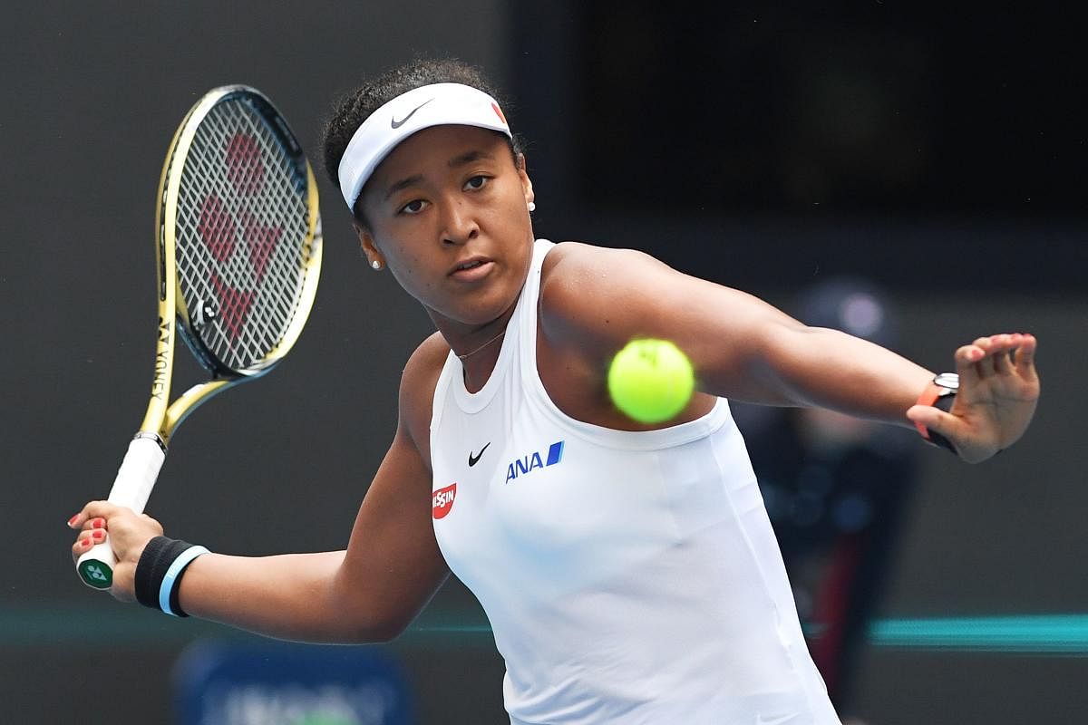 Naomi Osaka of Japan hits a return during her women's singles third round match against Alison Riske of the US at the China Open tennis tournament in Beijing on October 3, 2019. (AFP)