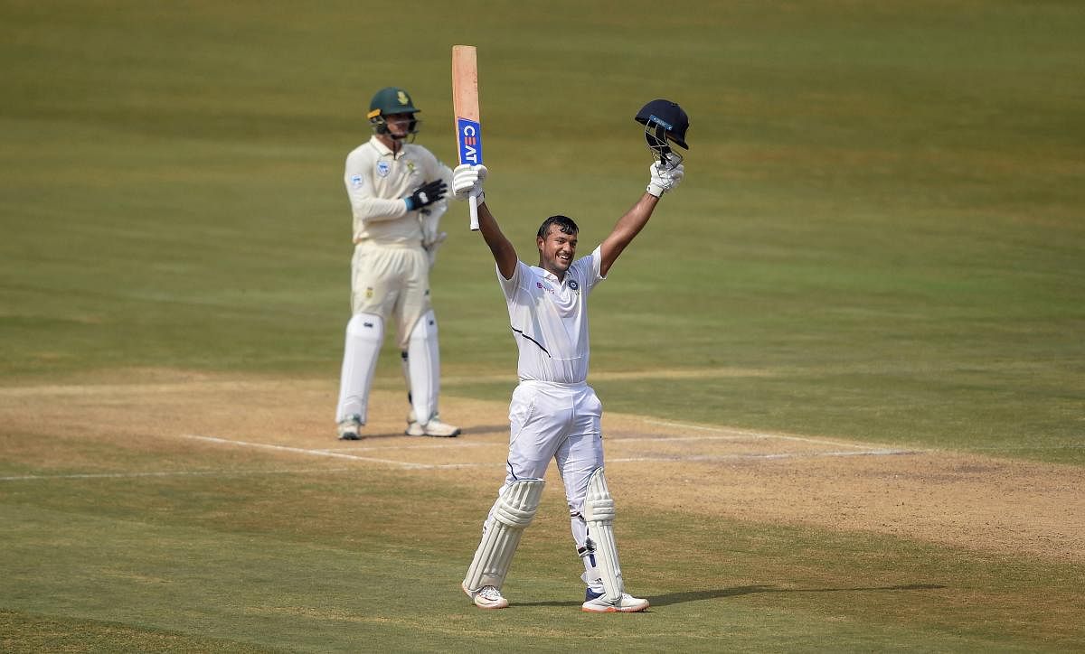 Mayank Agarwal celebrates after completing his double-century on day two of India's opening Test against South Africa. PTI