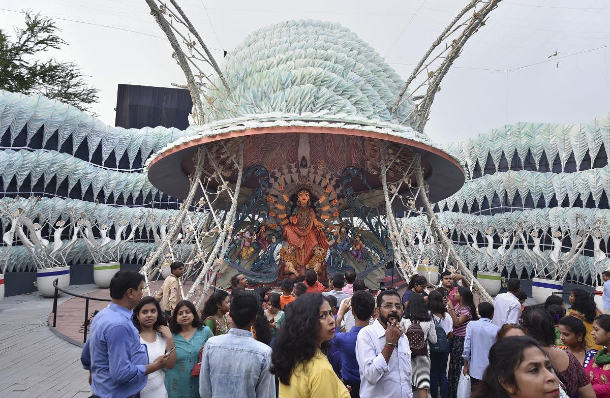 Kolkata: Devotees visit a community Durga puja pandal