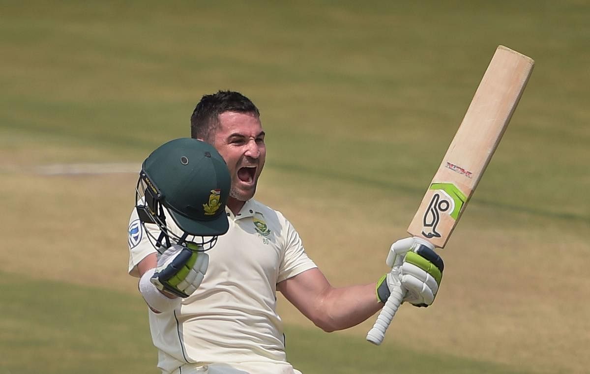 South African batsman Dean Elgar celebrates after bringing up his century on the third day of the first Test against India in Visakhapatnam on Friday. PTI