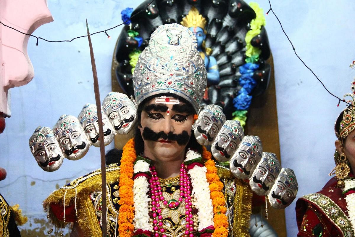 An Indian artist dressed as demon king Ravana looks on during the religious procession Ravan Ki Barat, to mark the Dussehra festival, in Allahabad on September 25, 2019. (Photo by AFP)