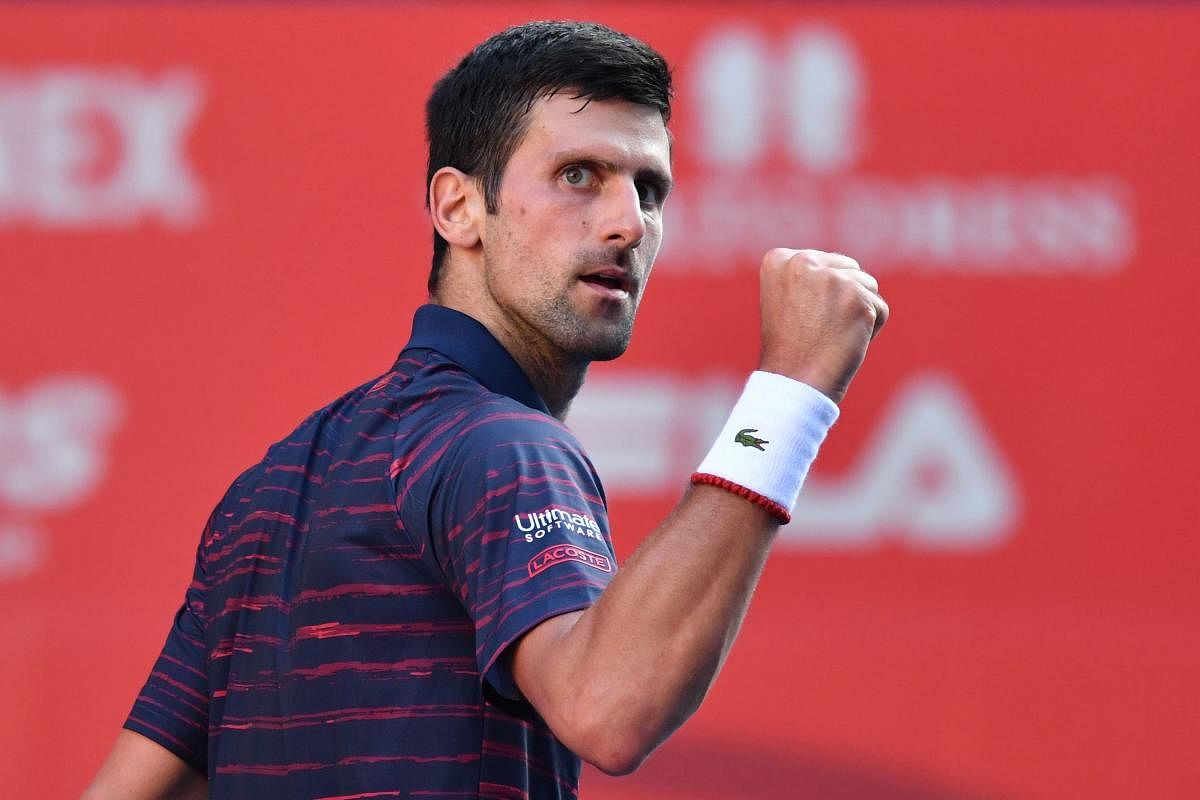 Serbia's Novak Djokovic reacts following a point against Belgium's David Goffin in their men's singles semi-final match at the Japan Open tennis tournament in Tokyo on October 5, 2019. (AFP)