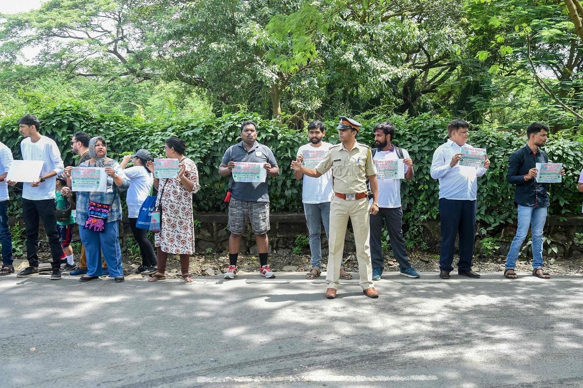 residents protesting against the destruction of Aarey forest which they call "Mumbai's Amazon", after the government approved cutting down 2,700 trees for constructing a metro train car shed, in Mumbai. (Photo by AFP)