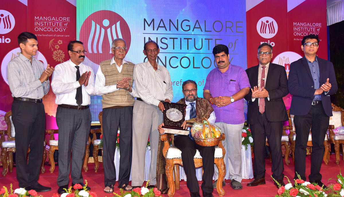Mangaluru South MLA D Vedavyas Kamath felicitates Dr Suresh Rao, Mangalore Institute of Oncology (MIO) Director and Radiation Oncology head, at the MIO Day programme held on the hospital premises on Saturday.