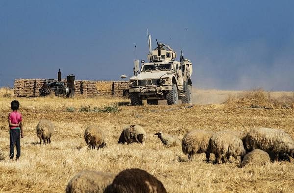 A US military vehicle takes part in joint patrol with Turkish forces in the Syrian village of al-Hashisha on the outskirts of Tal Abyad town along the border with Turkey, on October 4, 2019. (AFP photo)