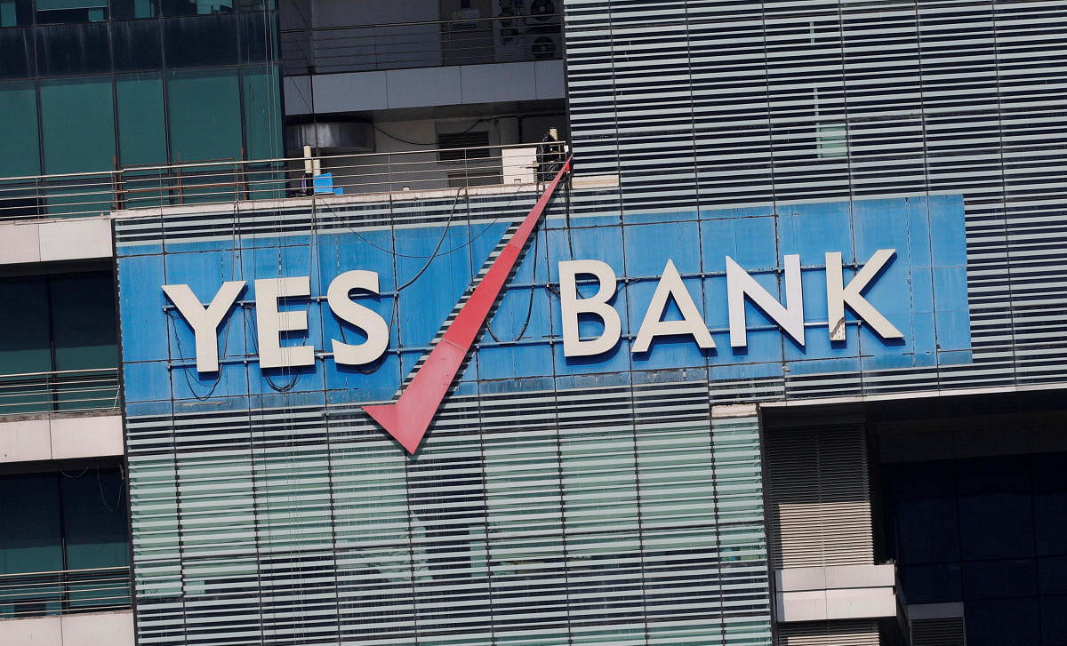 The logo of Yes Bank is pictured on the facade of its headquarters in Mumbai. (Photo by Reuters)