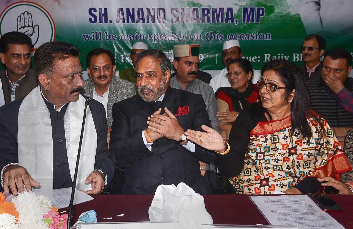 Rajya Sabha member Anand Sharma flanked by Congress state President Kuldeep Singh Rathore and state party in-charge Rajni Patil during a meeting, in Shimla, Tuesday, Oct. 1, 2019. (PTI Photo)