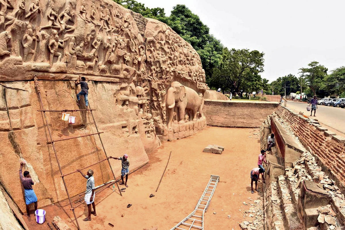 Workers cleaning up the world heritage site monuments ahead of the informal summit between Prime Minister Narendra Modi and Chinese President Xi Jinping this week. (PTI Photo)
