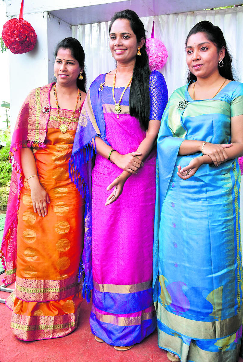 Top women officials of the district, Superintendent of Police Dr Suman D Penneker, Deputy Commissioner Annies Kanmani Joy and Zilla Panchayat CEO K Lakshmi Priya wearing sarees in traditional Kodava style.
