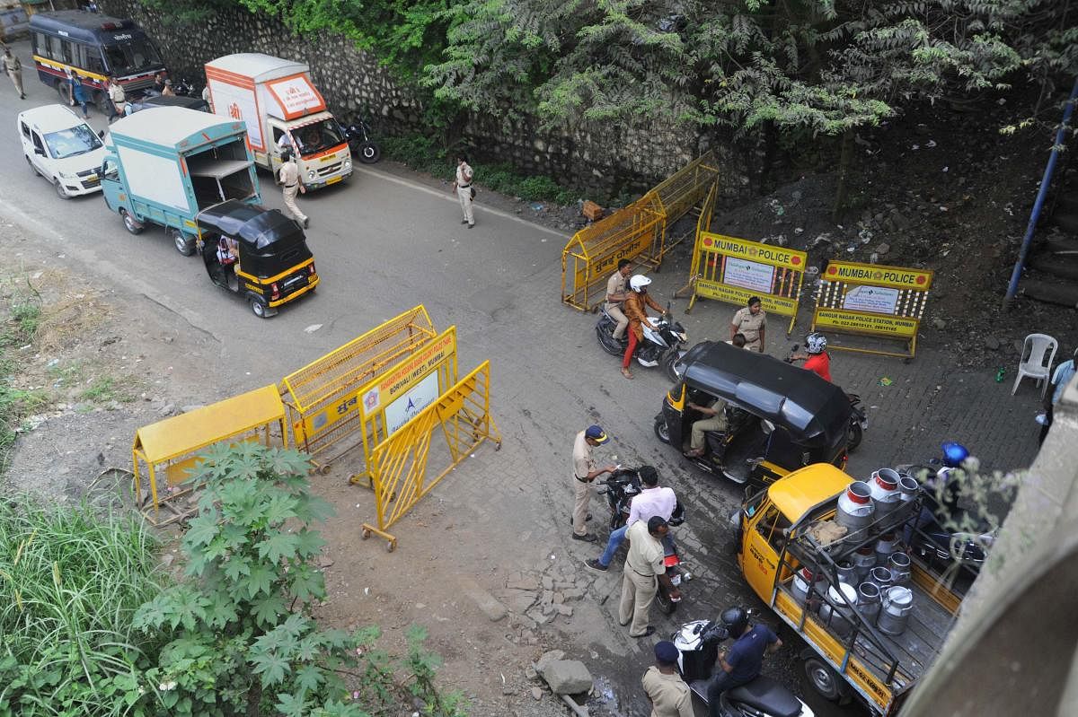 Police personnel check commuters for identification cards before being allowed to enter Aarey colony, in Mumbai, Monday, Oct. 7, 2019. (PTI Photo)