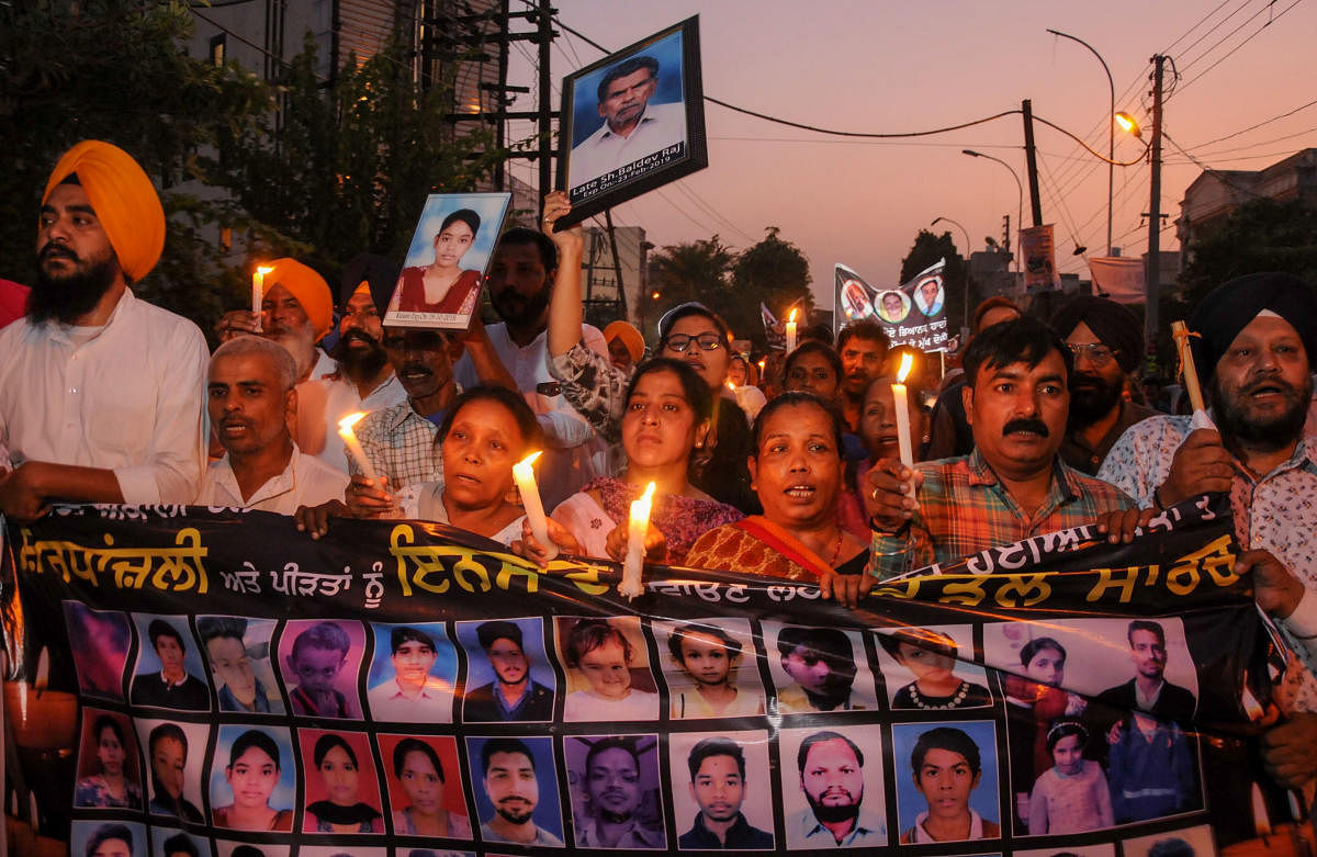 Family members of victims who died in the train tragedy on Dussehra last year take out a candlelight march along with SAD leaders, in Amritsar, Monday, Oct. 7, 2019. (PTI Photo)
