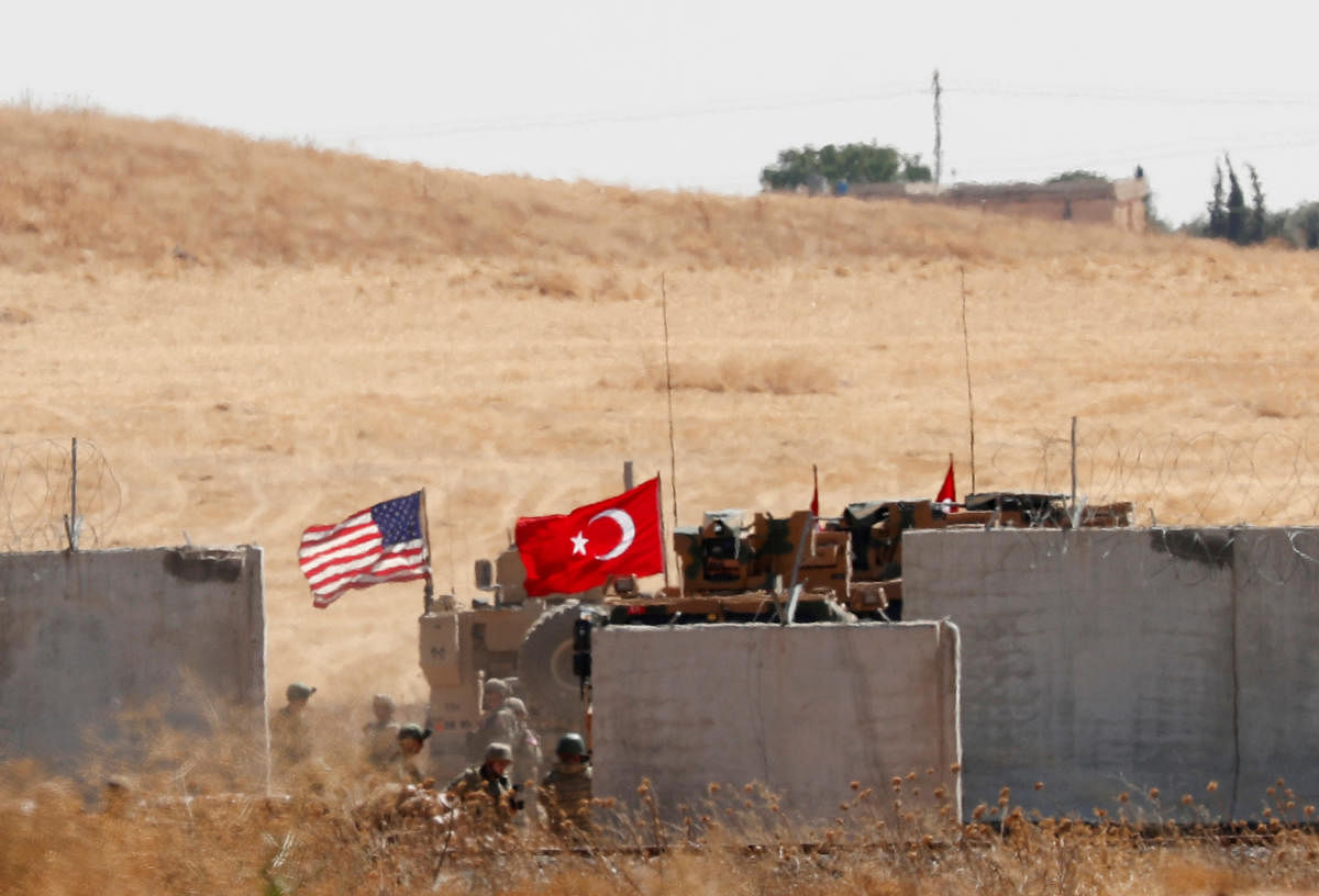 FILE PHOTO: Turkish and U.S. troops return from a joint U.S.-Turkey patrol in northern Syria, as it is pictured from near the Turkish town of Akcakale, Turkey, September 8, 2019. REUTERS