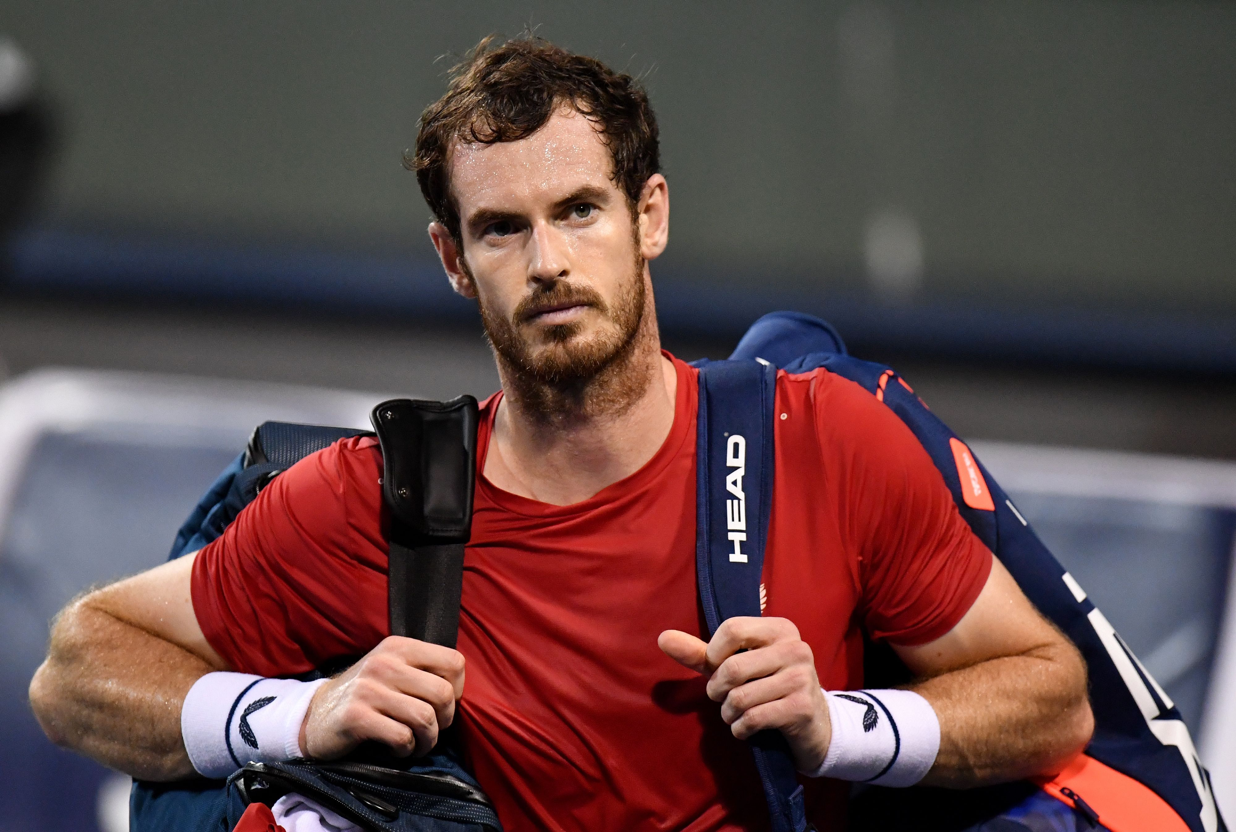 Andy Murray of Britain leaves the court after losing against Fabio Fognini of Italy in their men's singles match at the Shanghai Masters tennis tournament in Shanghai. (AFP Photo)