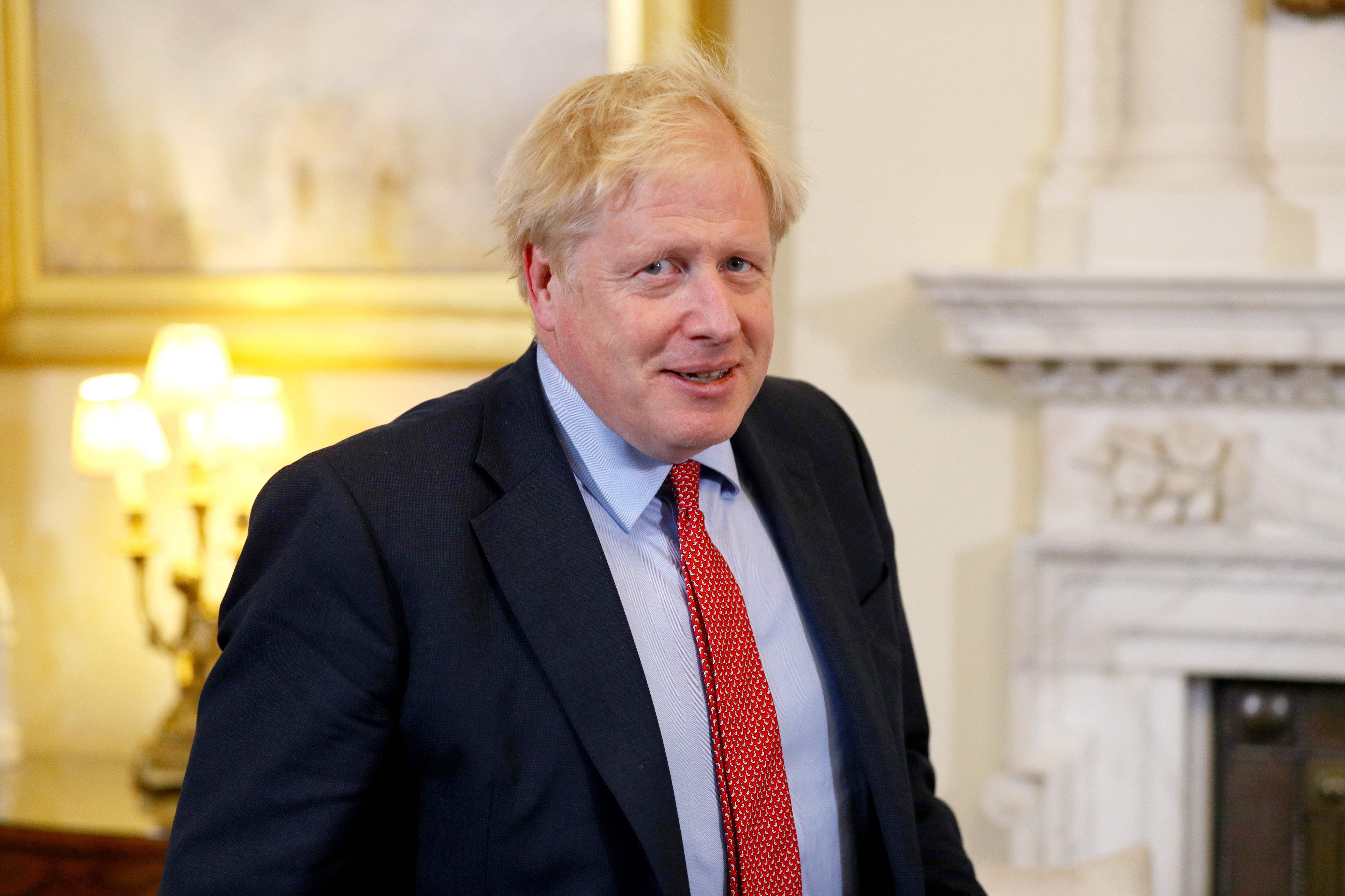 Britain's Prime Minister Boris Johnson prepares to greet European Parliament president David Sassoli. (AFP Photo)