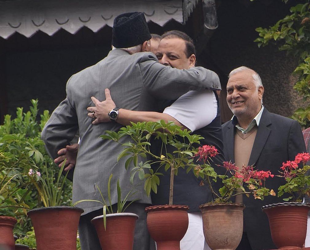 Farooq Abdullah hugging NC provincial president Devender Singh Rana. (Twitter)