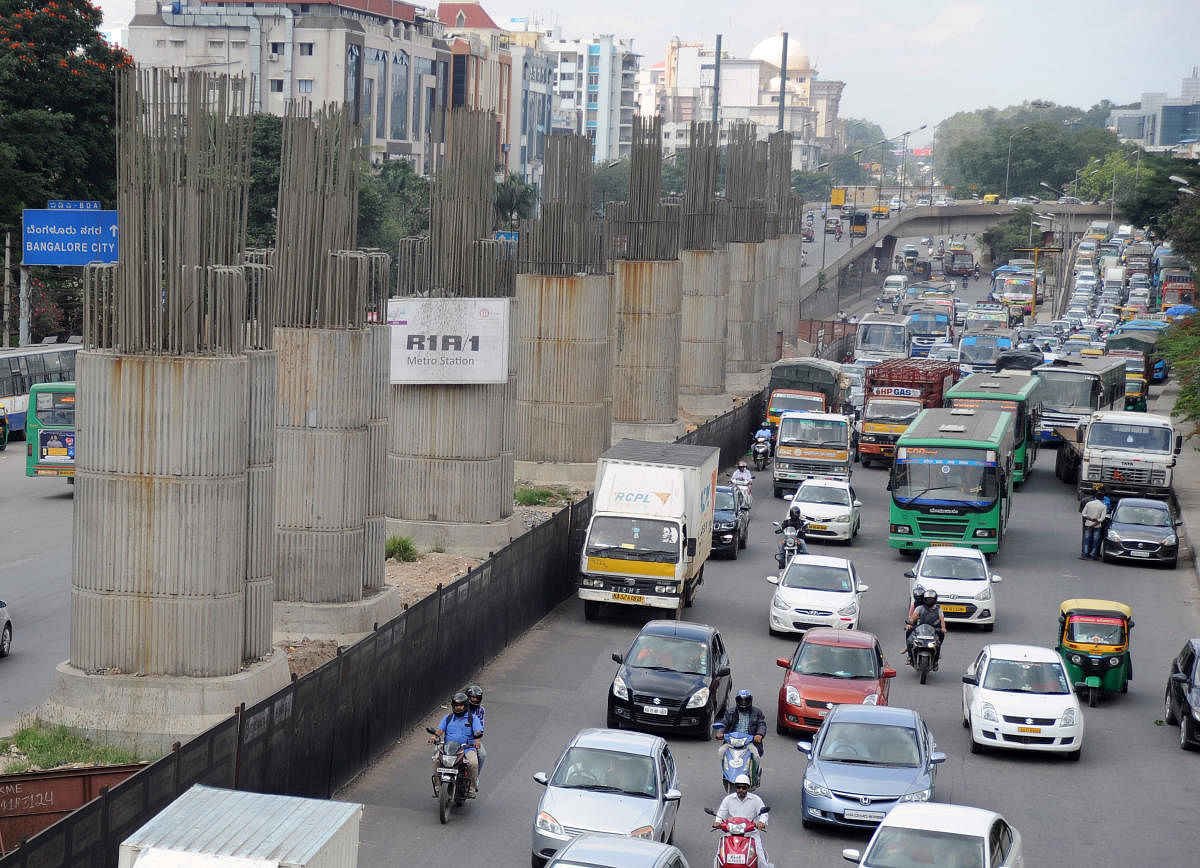 Metro construction under way near KR Puram Hanging Bridge in Bengaluru on Saturday. | DH Photo: Pushkar V