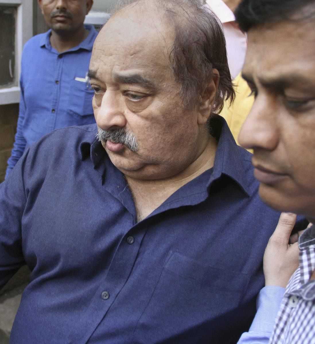 HDIL Executive Chairperson Rakesh Wadhawan being produced at Killa Court. (PTI Photo)