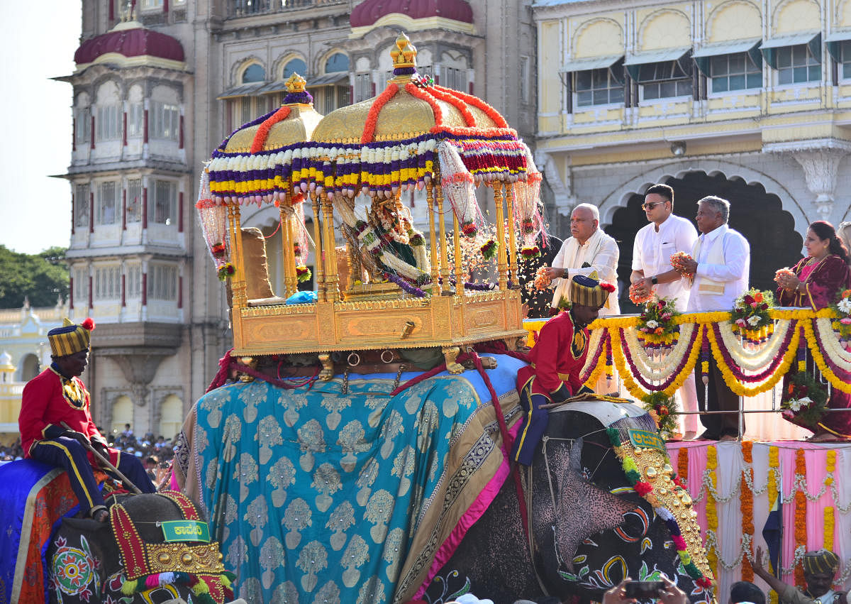 Chief Minister B S Yediyurappa offer floral tributes to the idol of Sri Chamundeshwari in the Golden Howdah to mark the beginning of the Dasara Vijayadashami Jamboo Savari, on the premises of Mysuru Palace, in Mysuru, on Tuesday. Yaduveer Krishnadatta Cha