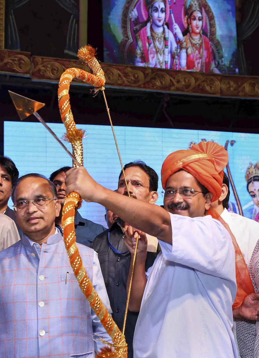 Delhi Chief Minister Arvind Kejriwal prepares holds a bow and arrow at Luv Kush Ramleela on the occasion of Vijaya Dashami ( Dussehra), in New Delhi, Tuesday, Oct. 8, 2019. (PTI Photo)