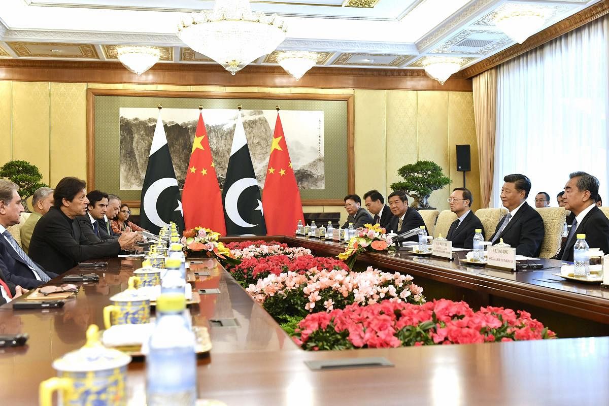 Pakistan's Prime Minister Imran Khan, second left, talks to Chinese President Xi Jinping, second right, during their meeting at the Diaoyutai State Guesthouse in Beijing on Wednesday. (AP/PTI)