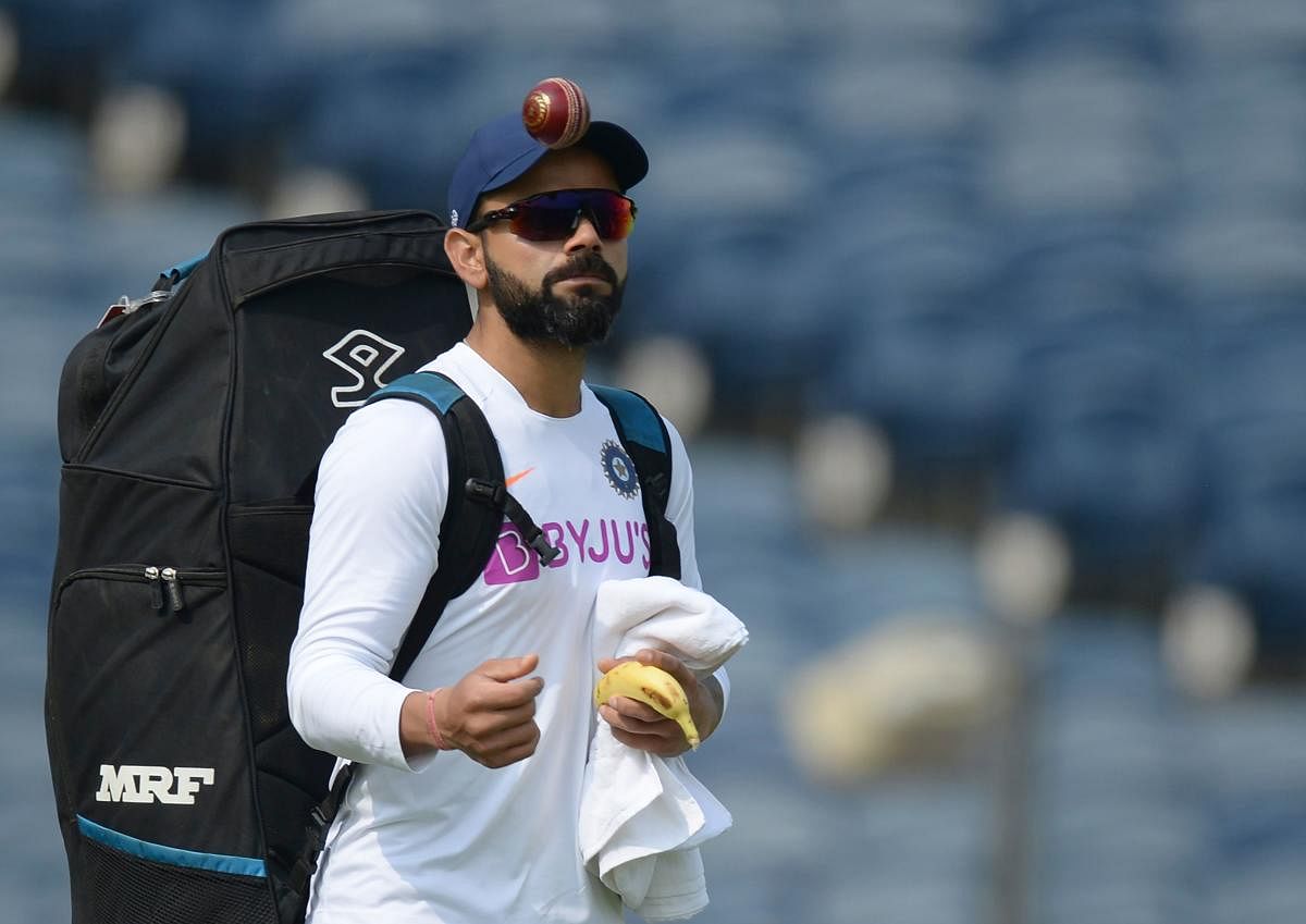 Indian team captain Virat Kohli arrives to attend a cricket training session ahead of the second test match between India and South Africa at the Maharashtra Cricket Association Stadium in Pune on October 9, 2019. (AFP)