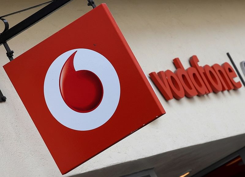 Branding hangs outside a Vodafone shop in Oxford, Britain. (Reuters Photo)