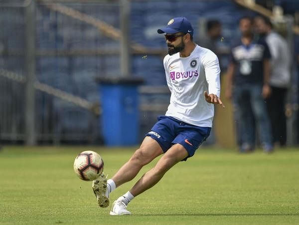 Indian cricket team captain Virat Kohli in action during a practice session ahead of India-South Africa second cricket test match in Pune, Wednesday, Oct. 9. (PTI photo)