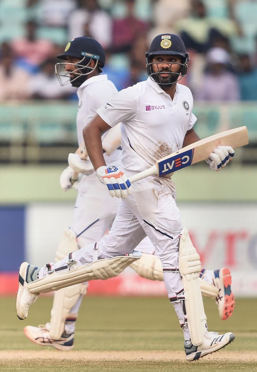 Cheteshwar Pujara (left) and Rohit Sharma will be watched keenly when they link up at the crease in the second Test.