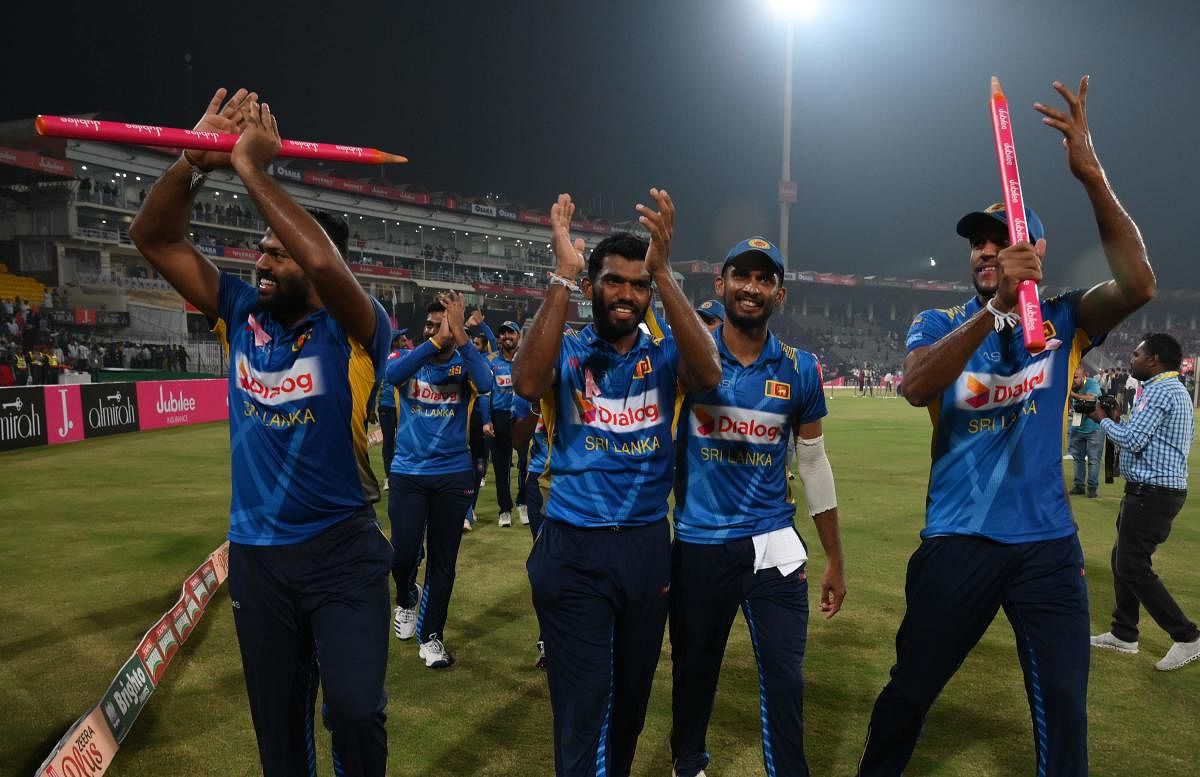 Sri Lanka's cricketers celebrate after beating Pakistan during the third and final Twenty20 International cricket match between Pakistan and Sri Lanka at the Gaddafi Cricket Stadium in Lahore on October 9, 2019. (Photo by AFP)
