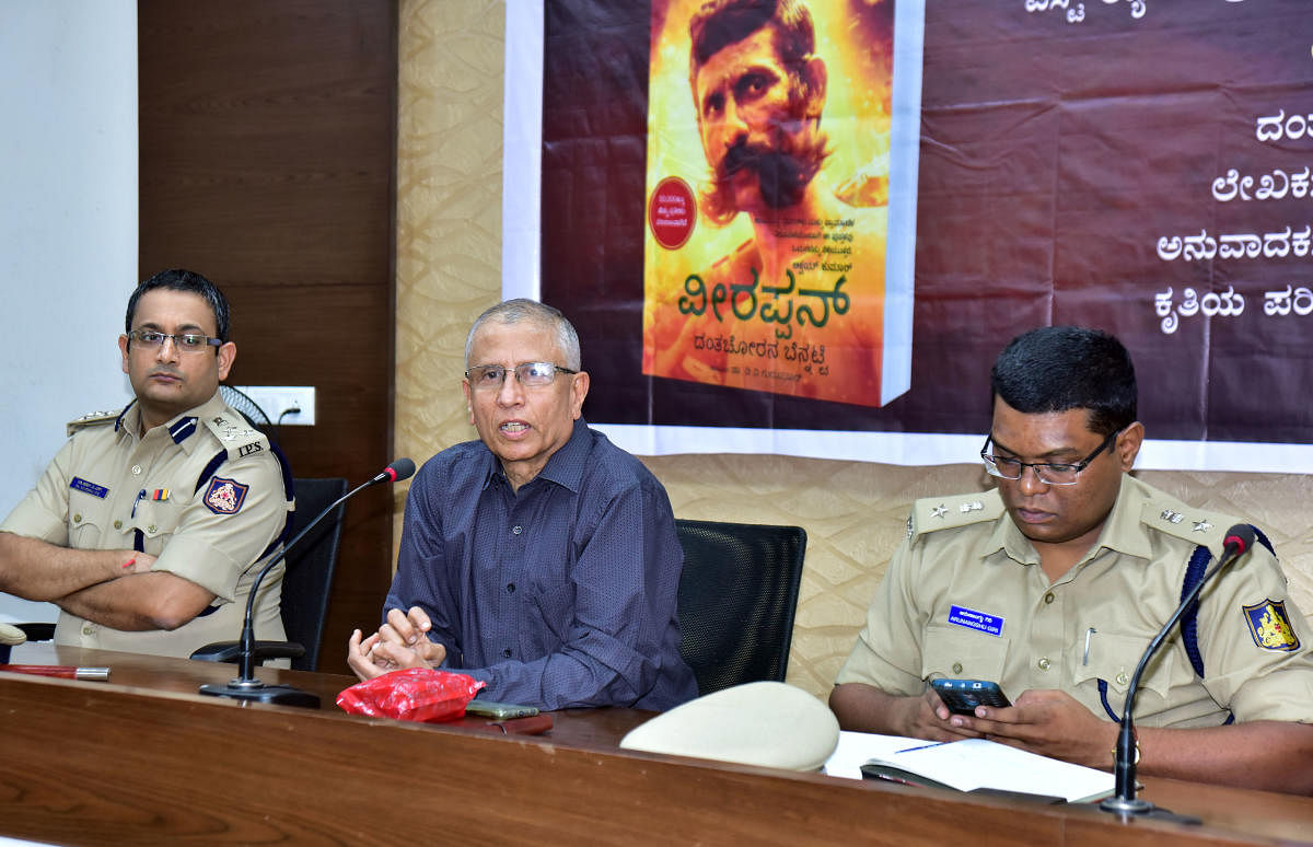 Dr D V Guruprasad, former chief of State Intelligence Department, speaks during programme at the Mangaluru City Police Commissionerate office on Thursday. Mangaluru Police Commissioner Dr P S Harsha and DC (Law and Order) Arunangshu Giri look on.