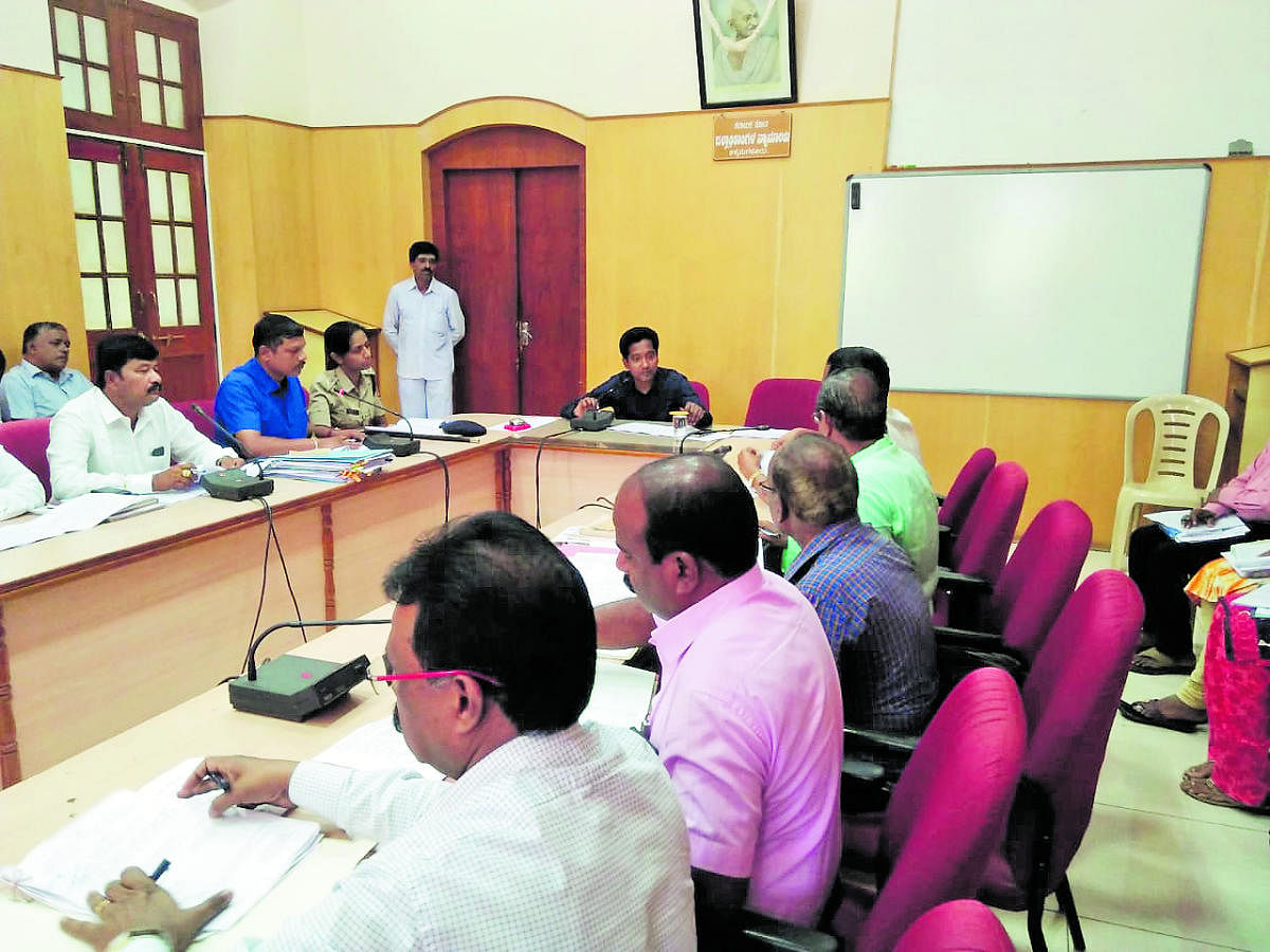 Deputy Commissioner Dr Bagadi Gautham speaks at the district-level meeting held at his office in Chikkamagaluru on Thursday.